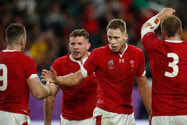Liam Williams celebrates after scoring Wales' fourth try