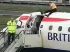 Extinction Rebellion protests: Arrests soar to 1,000 as blind paralympian clambers on top of British Airways plane