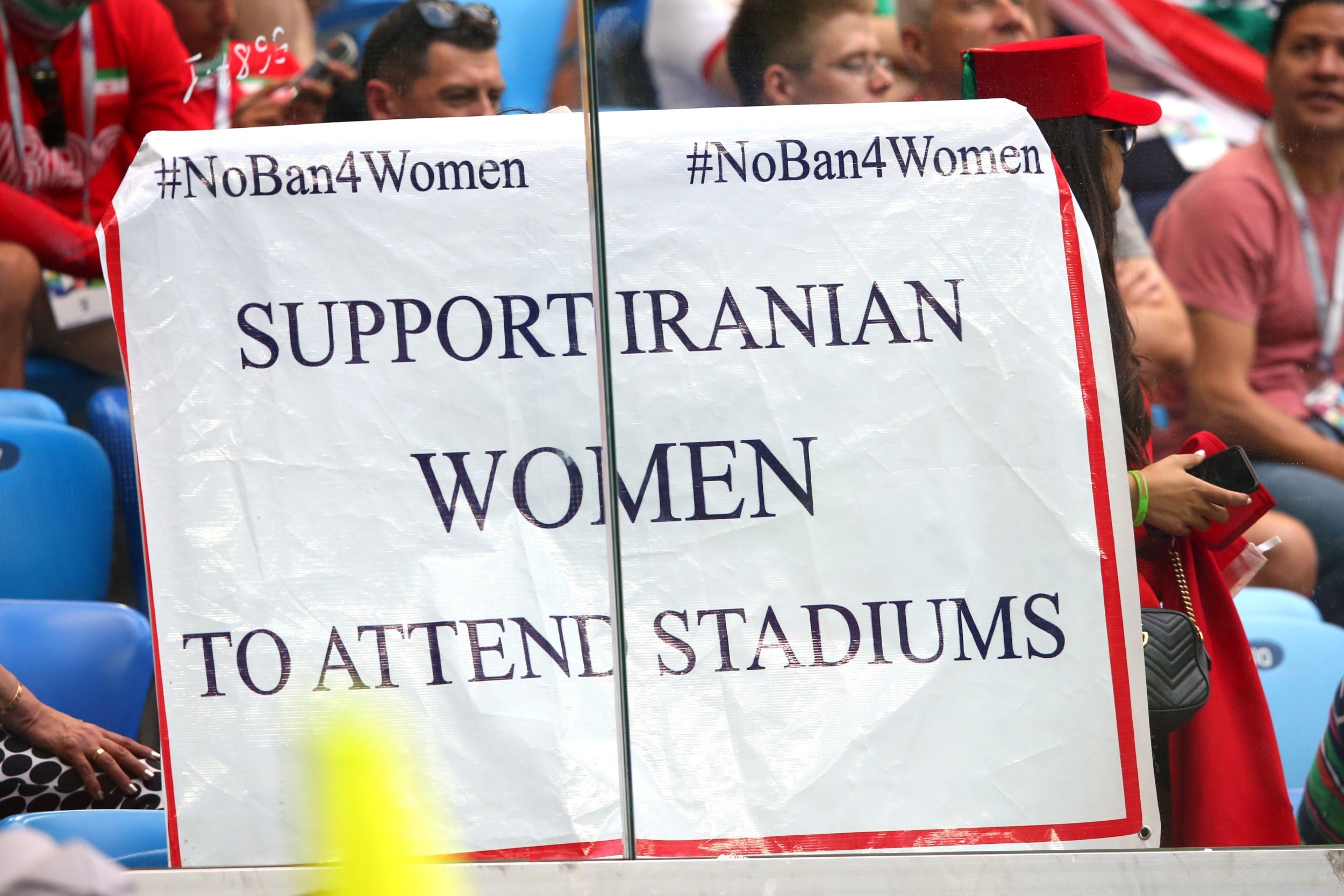 A sign supporting the #NoBan4Women movement at the 2018 World Cup match between Morocco and Iran, held in Russia