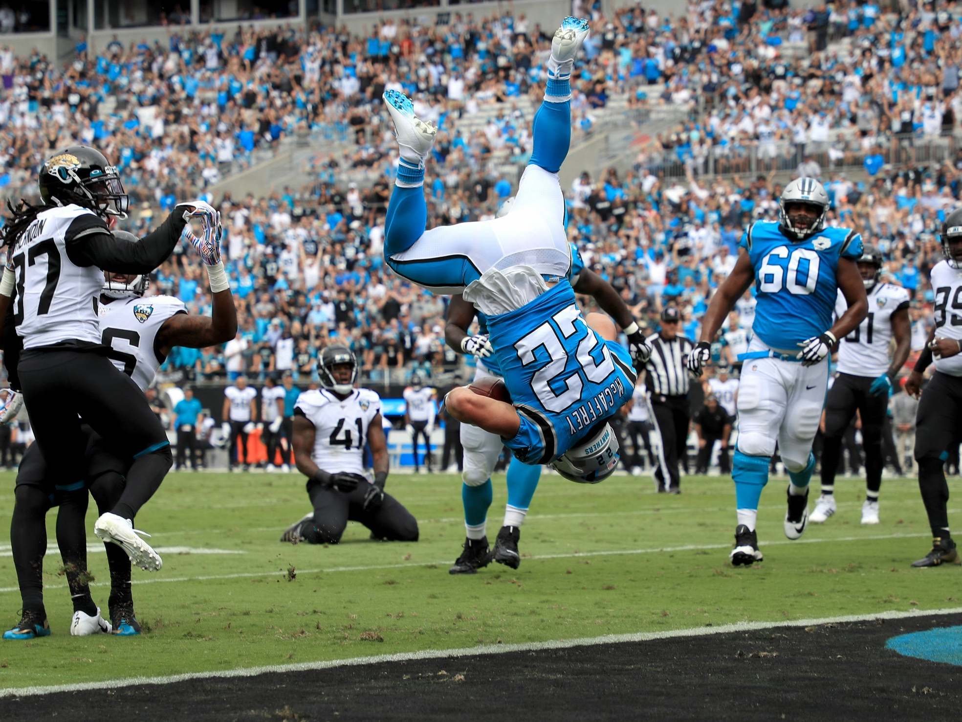 McCaffrey flips into the end zone to score a touchdown for the Panthers