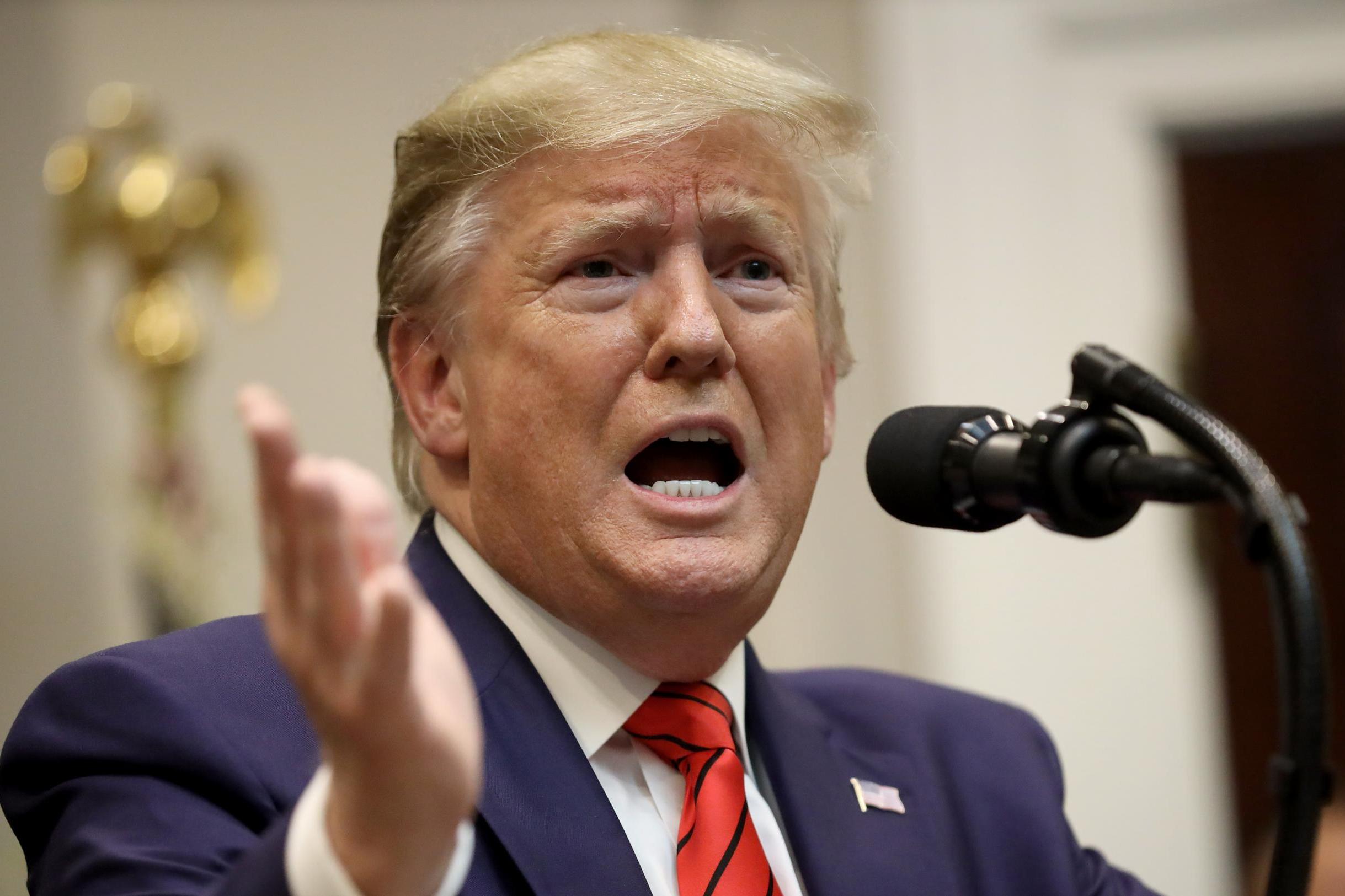 Donald Trump responds to a question from a reporter at an event for the signing of two executive orders at the White House on 9 October, 2019 in Washington, DC.
