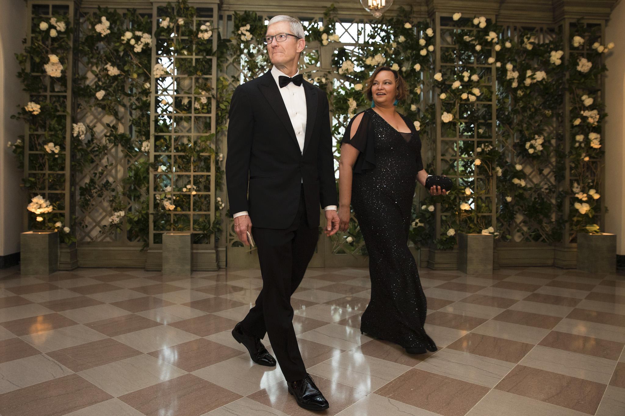Apple CEO Tim Cook and Lisa Jackson arrive at the White House for a state dinner April 24, 2018 in Washington, DC