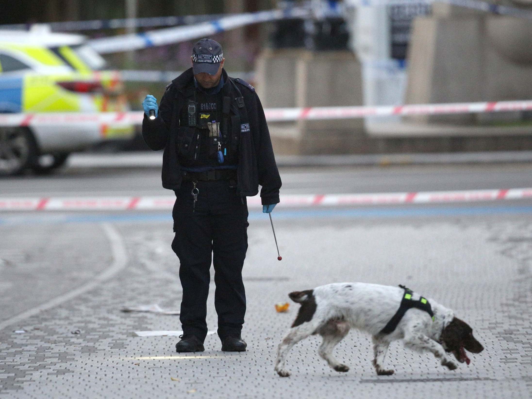 Police at the scene of a stabbing hours earlier at Stratford, east London, on October, 2019.