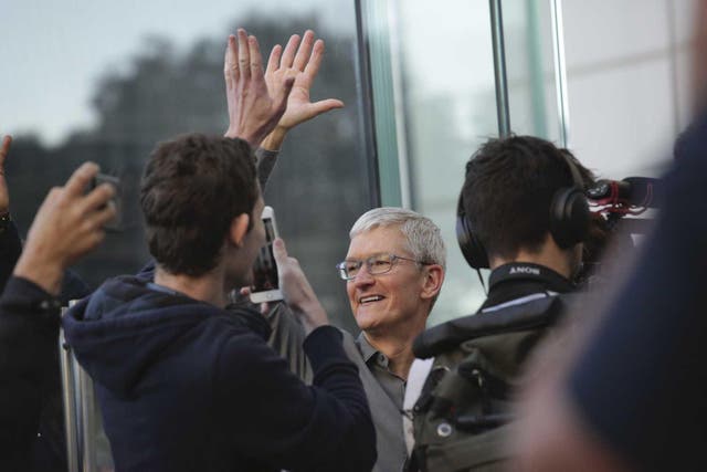 Apple CEO, Tim Cook openS the door of the newly renovated Apple Store at Fifth Avenue on September 20, 2019 in New York City