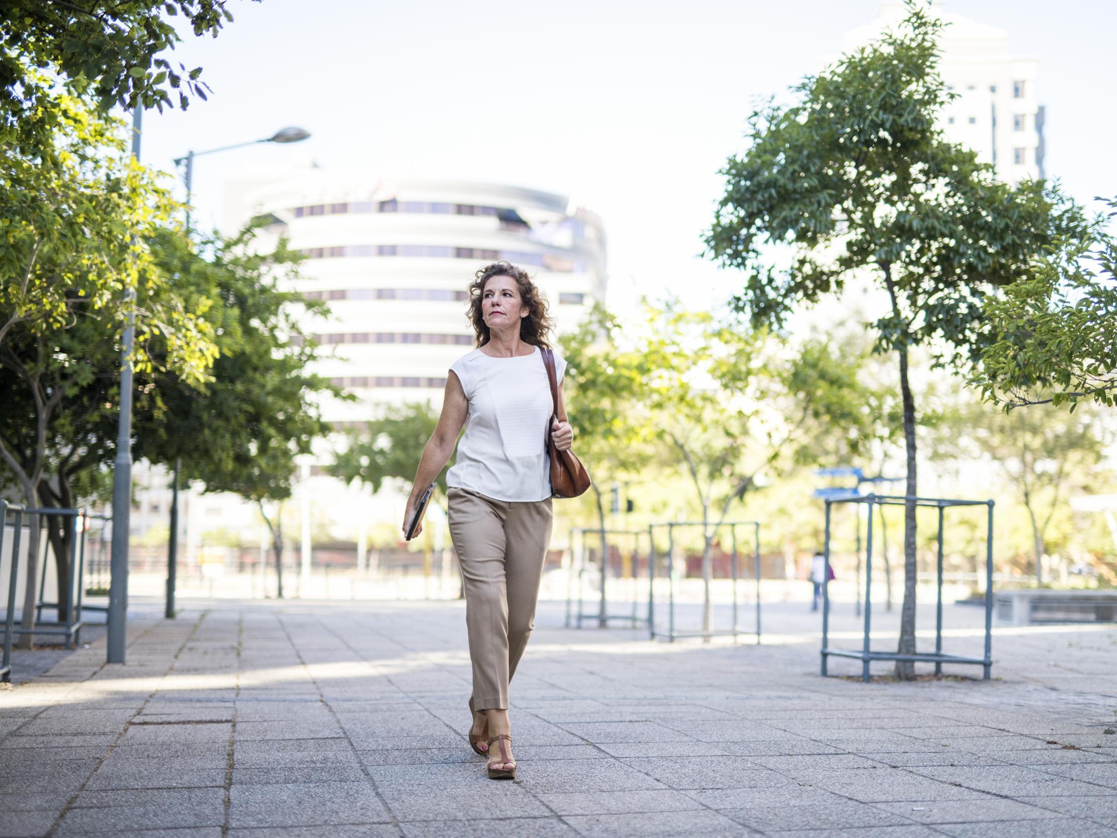 Foto de Beautiful mature woman on a walking. A nice middle aged