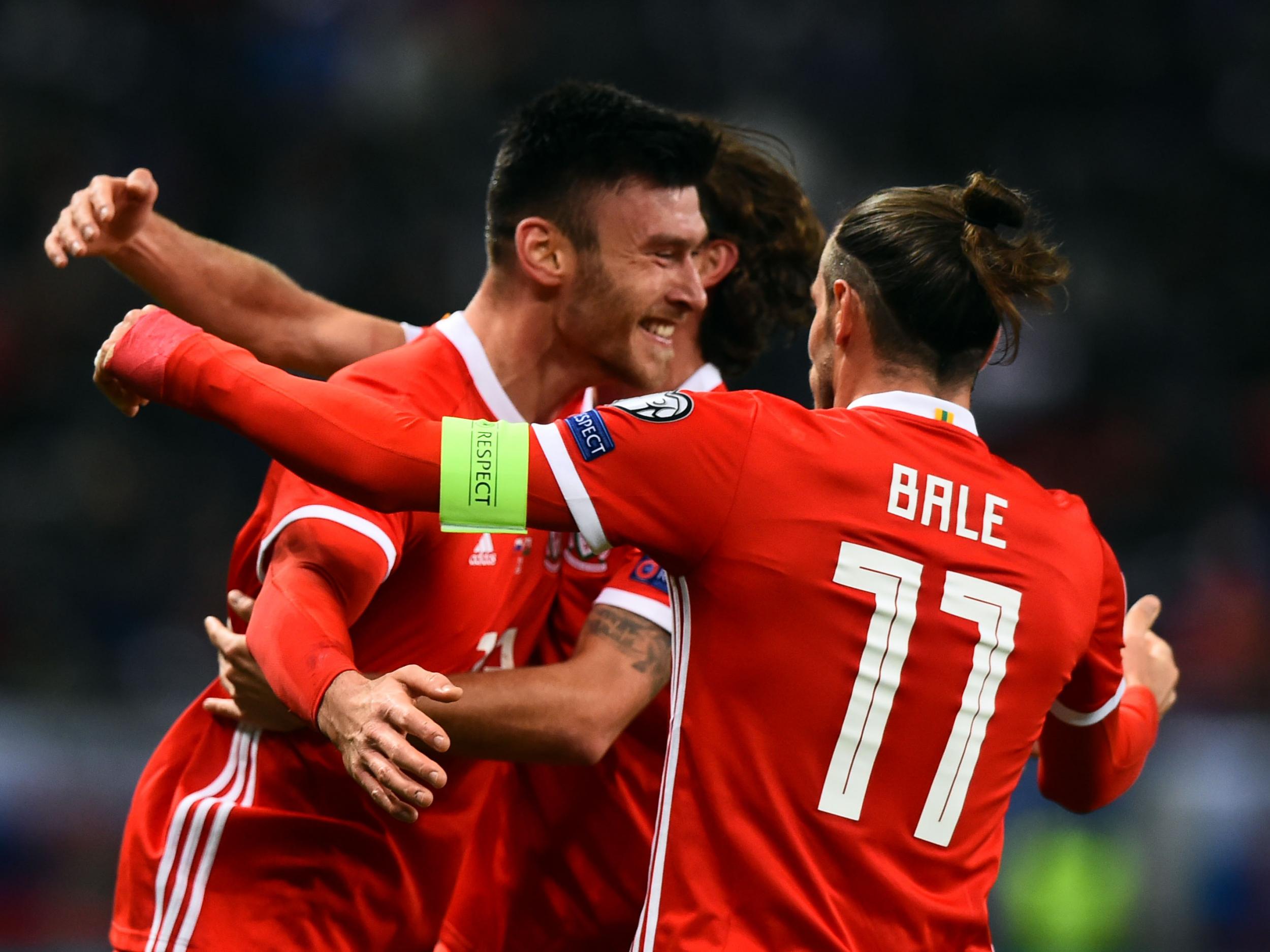 Wales kept their hopes alive with a 1-1 draw in Slovakia