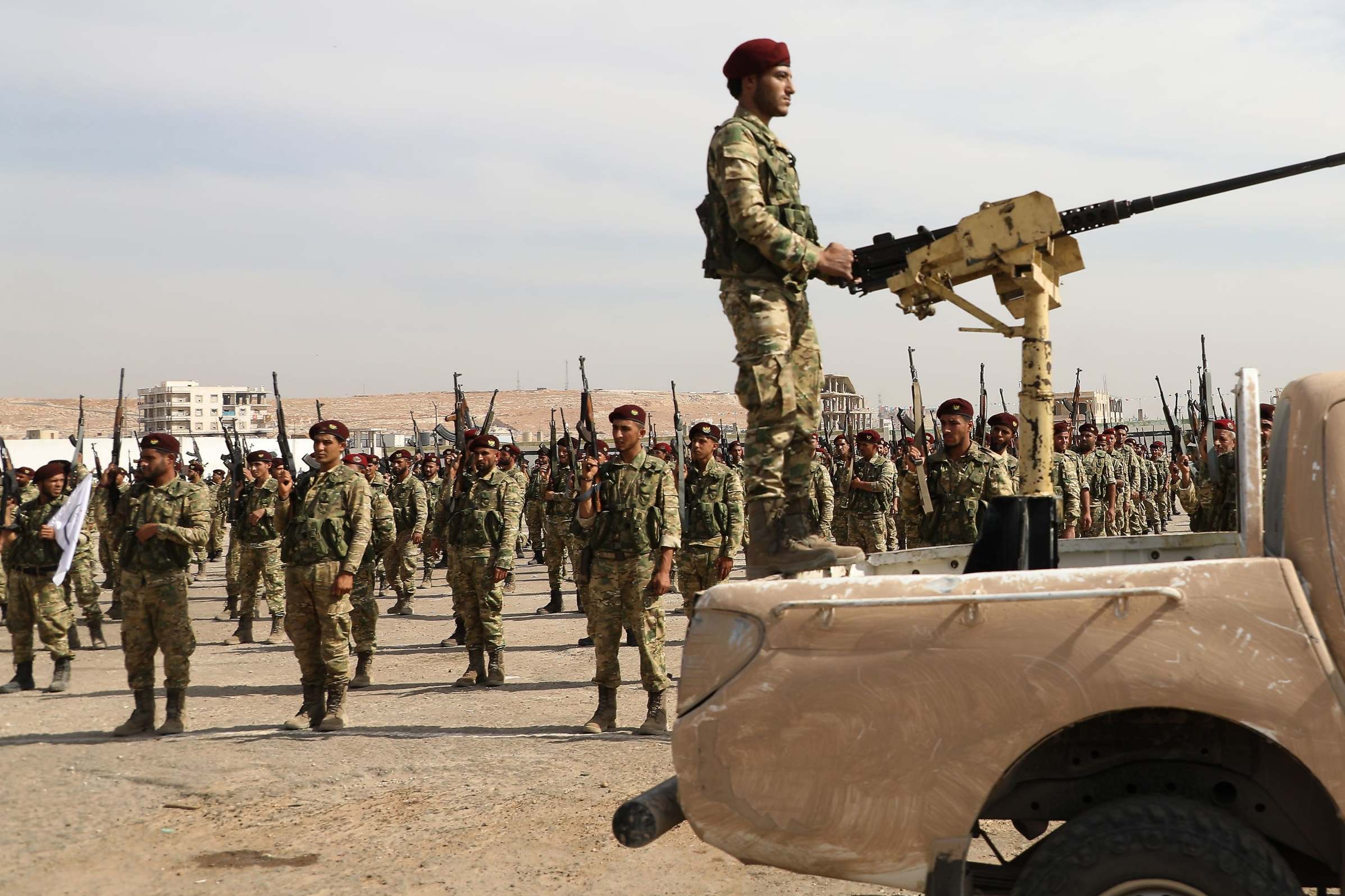 Turkish-backed Syrian rebels gather in al-Bab city in the eastern countryside of Aleppo province on October 11, 2019