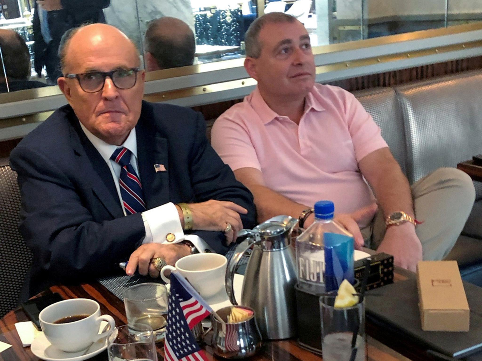 Ukrainian-American businessman Lev Parnas with President Trump's personal lawyer Rudy Giuliani at the Trump International Hotel in Washington, September 2019.