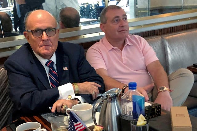 Ukrainian-American businessman Lev Parnas with President Trump's personal lawyer Rudy Giuliani at the Trump International Hotel in Washington, September 2019.