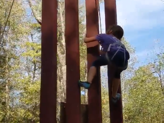 8-year-old Lucy Hancock climbs replica of Donald Trump's border wall