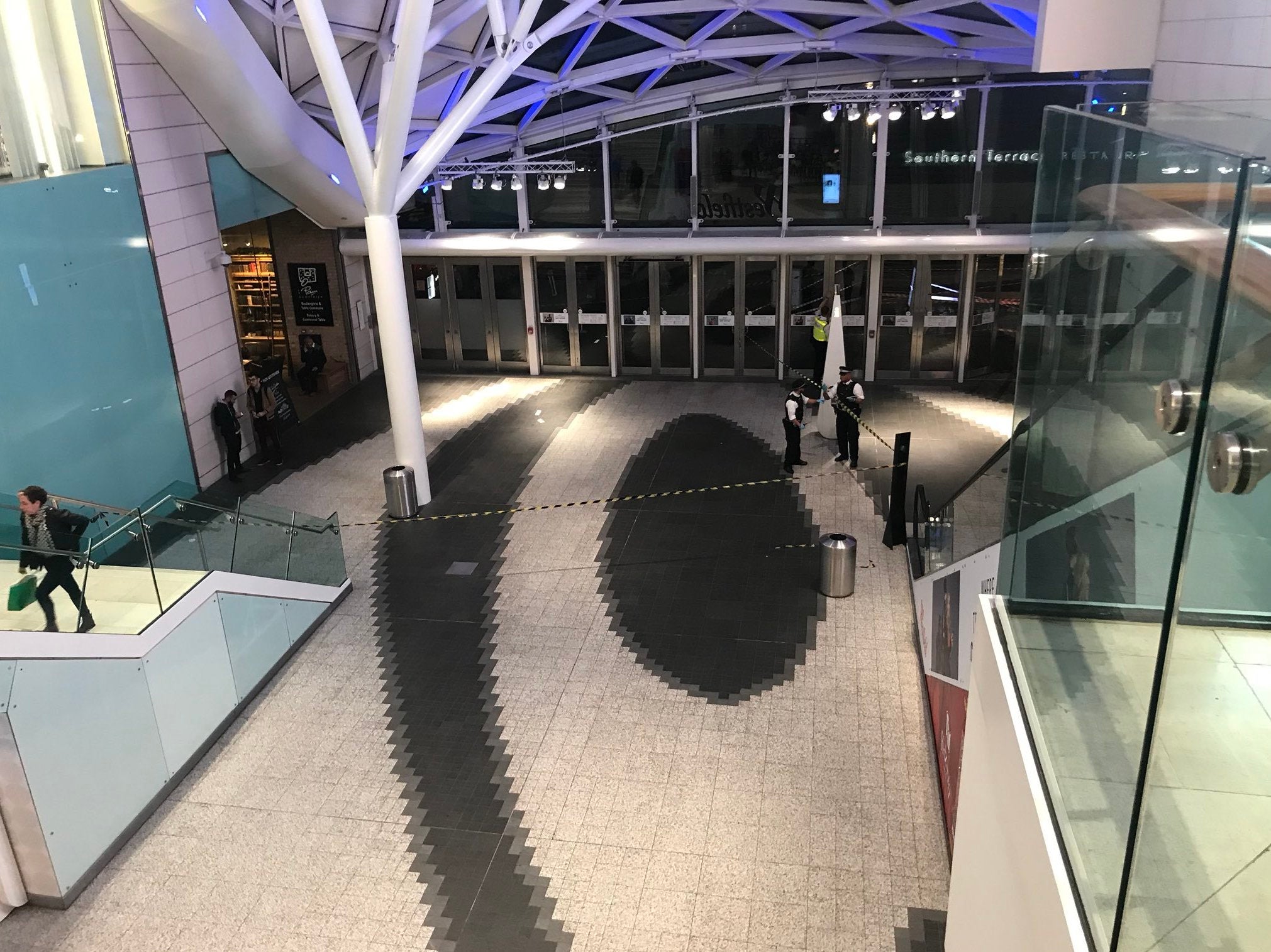 The police cordon inside Westfield London shopping centre in Shepherd's Bush where a man in his 20s was stabbed on 12 October 2019.