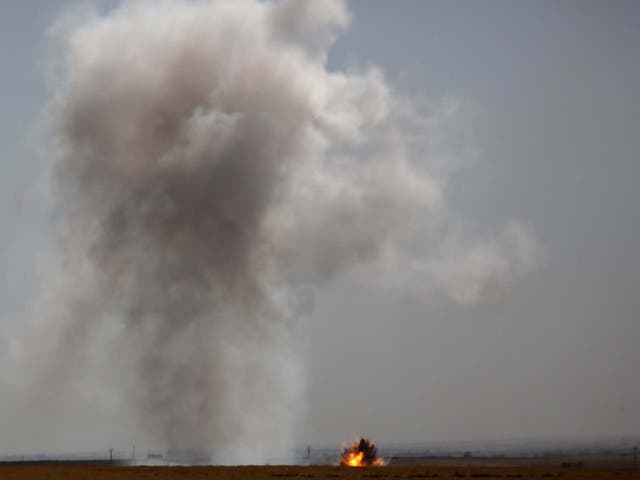 Smoke billows from the Syrian border town of Tal Abyad on October 12, 2019