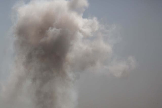 Smoke billows from the Syrian border town of Tal Abyad on October 12, 2019