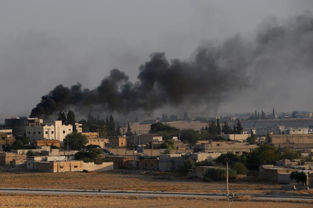 Smoke rises following a Turkish artillery bombardment on the Syrian border