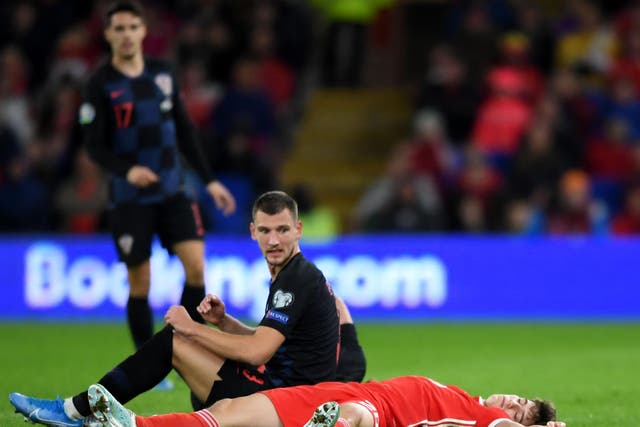 Daniel James appeared to be knocked out after clashing heads with Croatia's Domagoj Vida