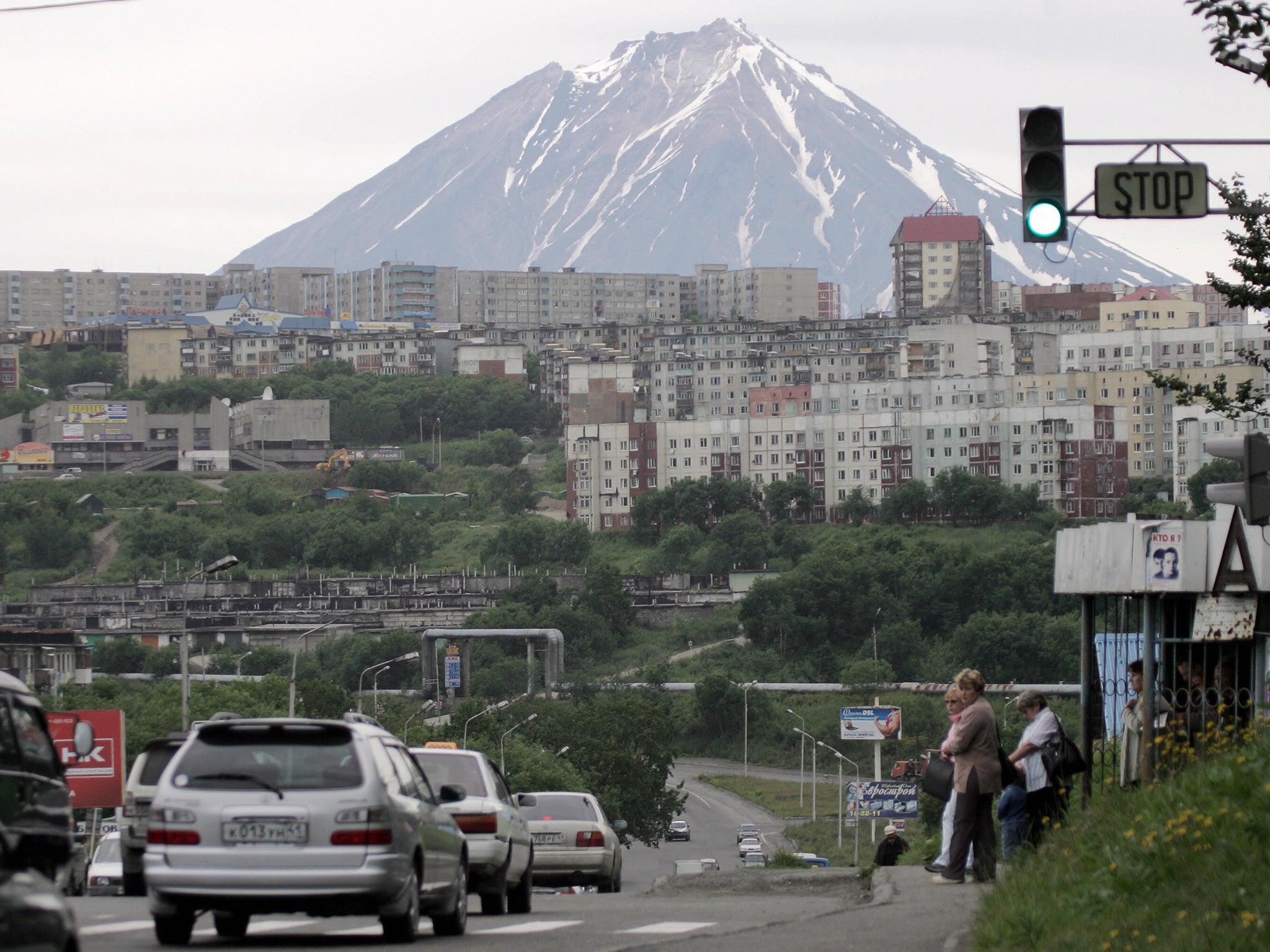 Petropavlovsk-Kamchatsky city stands in front of the Klyuchevskaya Sopka mountains