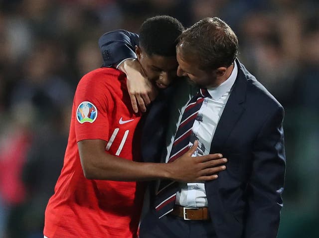 England manager Southgate hugs Rashford