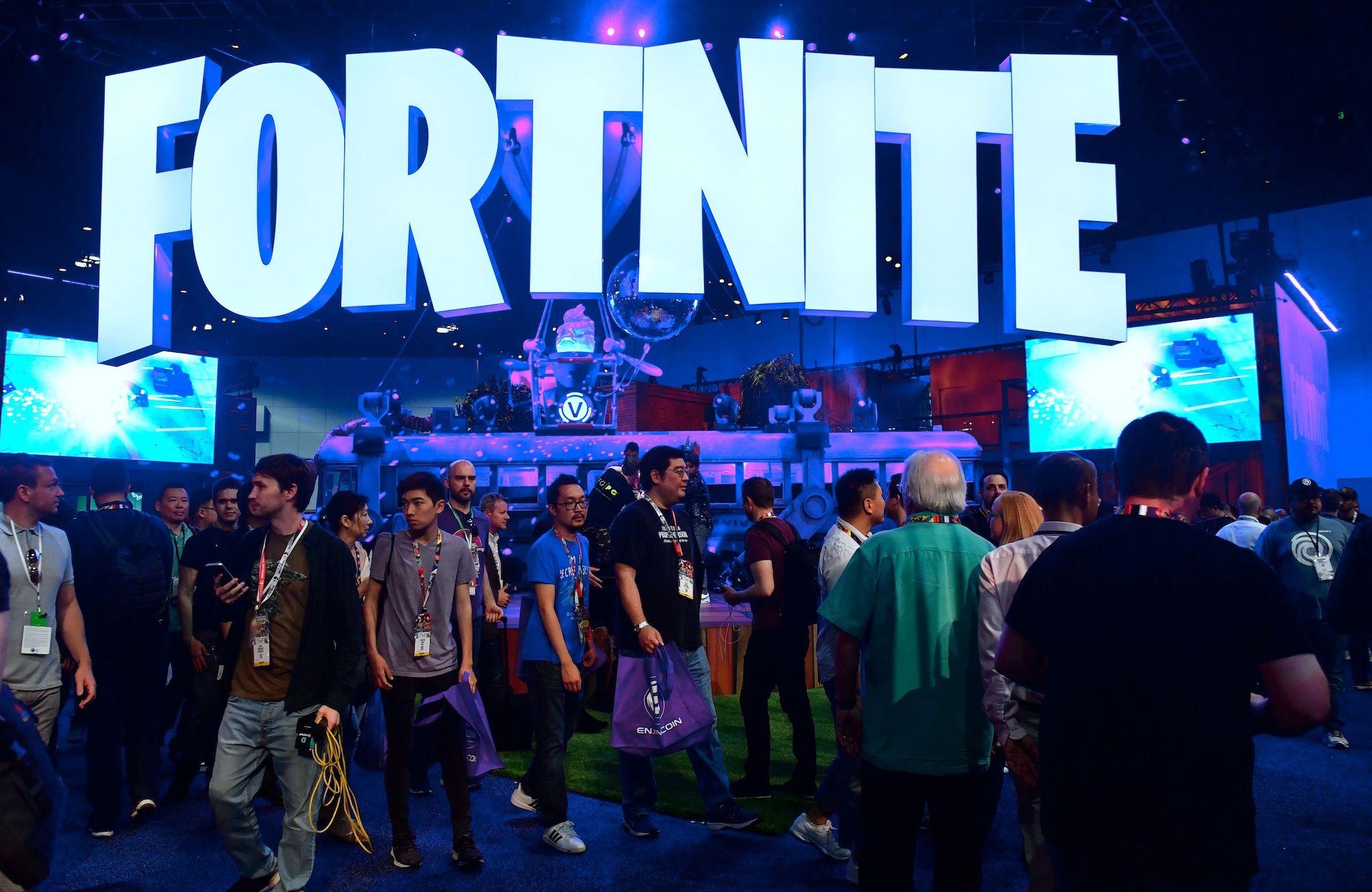 People crowd the display area for the survival game Fortnite at the 24th Electronic Expo, or E3 2018, in Los Angeles, California on on June 12, 2018