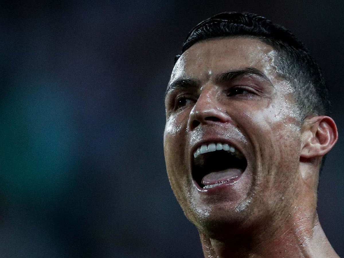 Cristiano Ronaldo sticking his tongue at the line up on Make a GIF