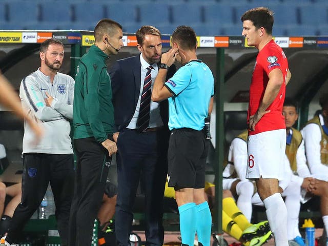 England manager Gareth Southgate speaks with referee Vasil Levski during the Euro 2020 qualifier between Bulgaria and England on 14 October 2019 in Sofia