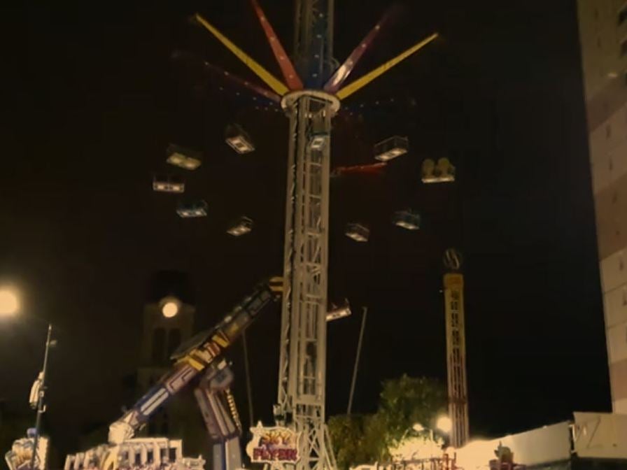 Still image from Télévision Loire 7 (TL7) video of the scene at a fun fair in Firminy, Loire, France, where a 24-year-old woman died after falling from the Sky Flyer swing chair ride on 14 October 2019.