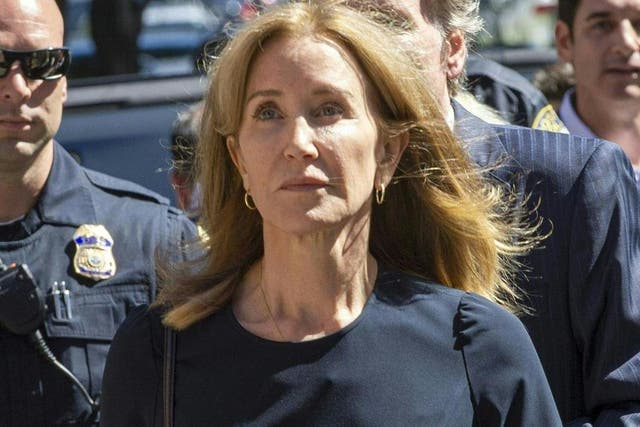 Felicity Huffman makes her way to the entrance of the John Joseph Moakley United States Courthouse on 13 September, 2019 in Boston, Massachusetts, for her sentencing.