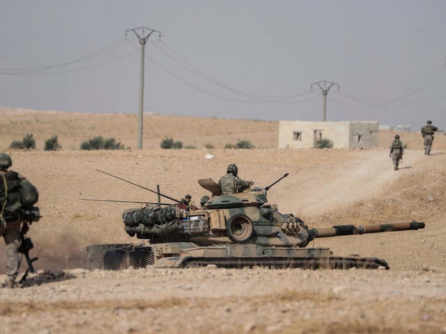 Turkish troops near the Syrian town of Manbij