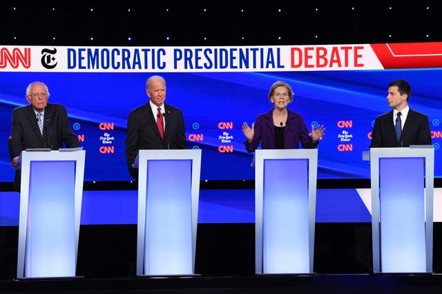 Joe Biden (second left) had a quiet night compared to rival Elizabeth Warren (second right) in Ohio on Tuesday