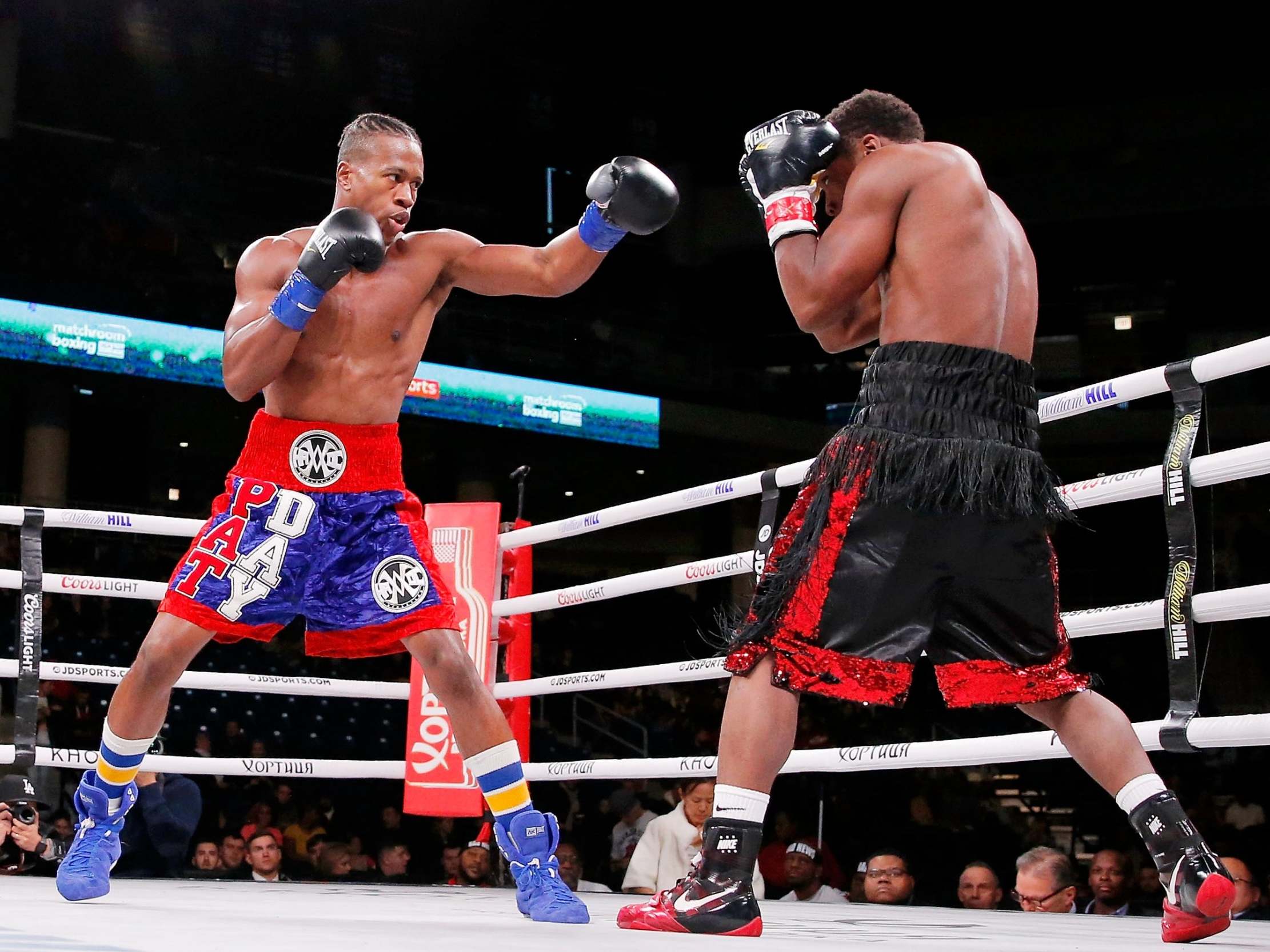 Charles Conwell (black trunks) and Patrick Day (red trunks)