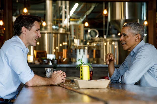 Barack Obama, pictured here at an Ontario brewery with Justin Trudeau in May, said 'the world needs his progressive leadership now'
