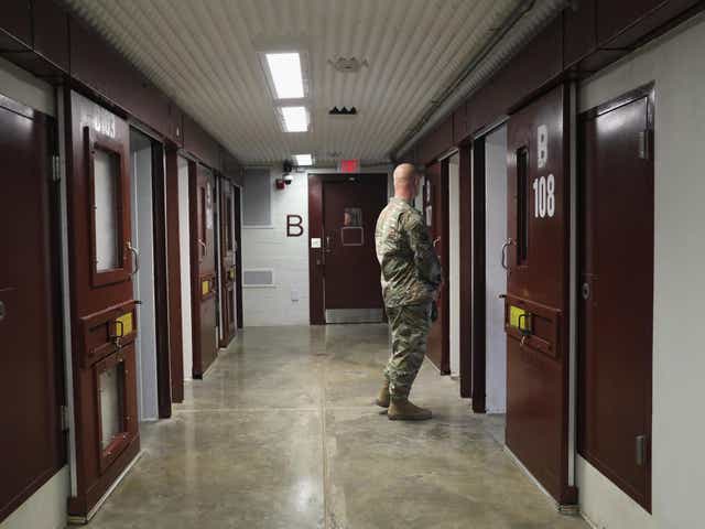 A US soldier patrols the notorious maximum security prison