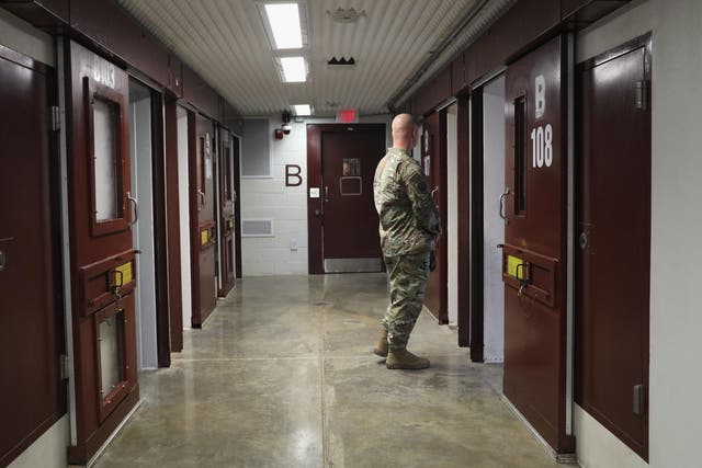 A US soldier patrols the notorious maximum security prison