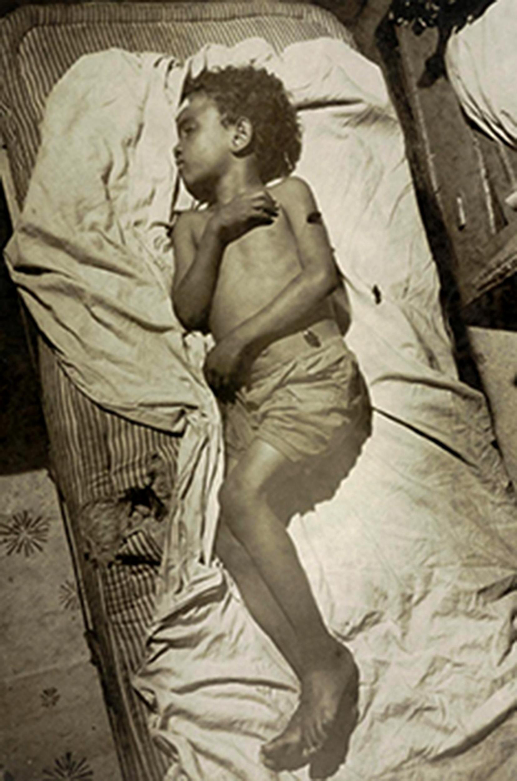 Ely-Samuel Gonzalez in his bed in Manhattan, New York
