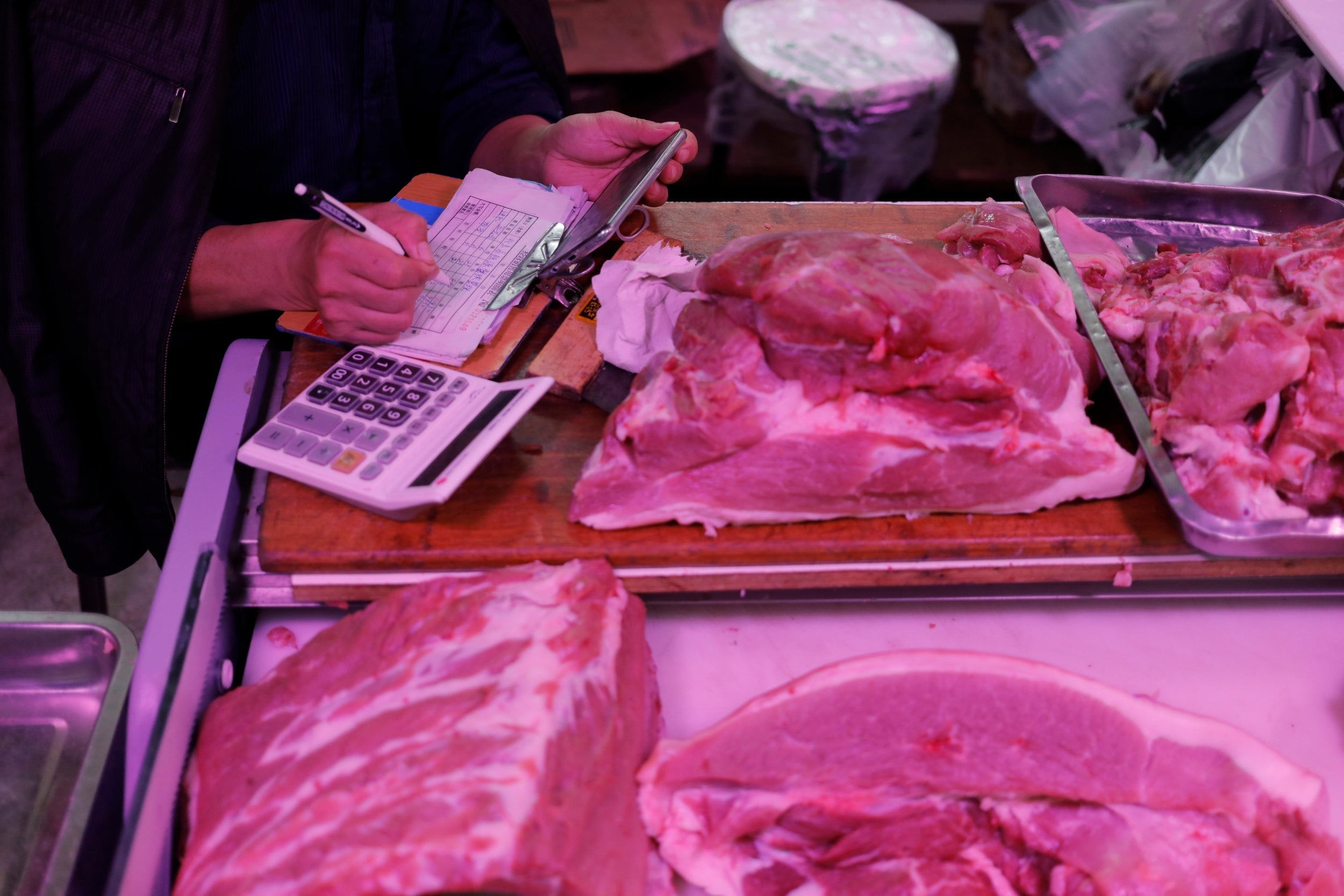 Pork on display at a market in Beijing, China. A huge swine fever epidemic has fuelled inflation and hurt consumer spending