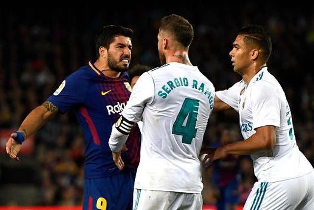 Luis Suarez and Sergio Ramos clash during El Clasico
