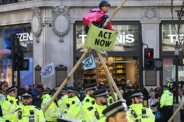 Extinction Rebellion protesters block roads at Oxford Circus