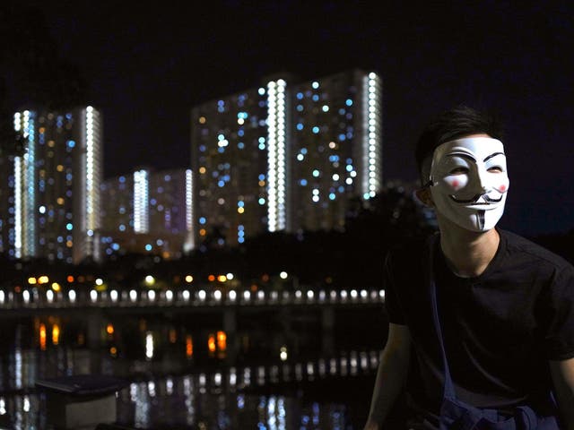 Pro-democracy protesters have been wearing black clothes and masks in Hong Kong (AP Photo/Vincent Wu)