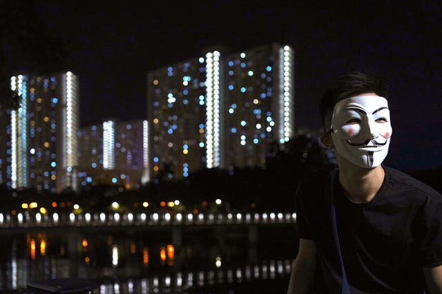 Pro-democracy protesters have been wearing black clothes and masks in Hong Kong (AP Photo/Vincent Wu)
