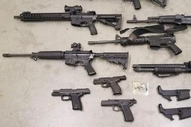 Officers seized several firearms and gun parts during the raid