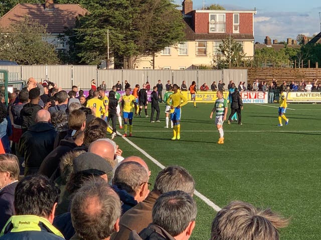 Haringey players, in yellow, left the field following the incident