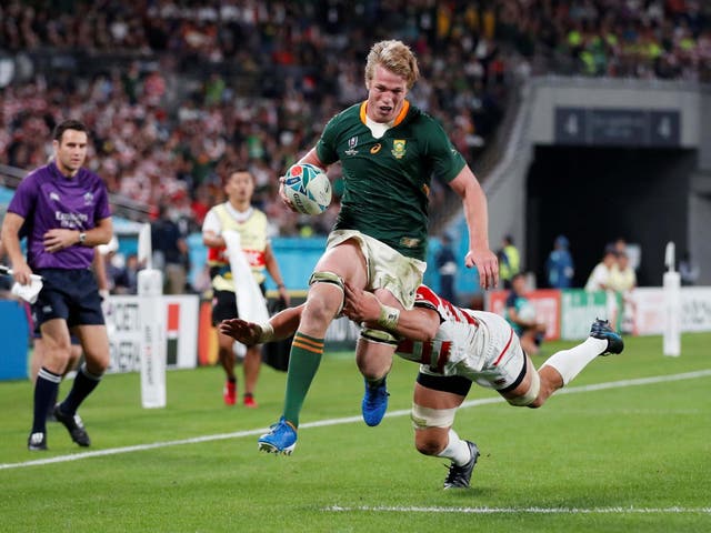 Japan's Pieter Labuschagne runs with the ball in hand