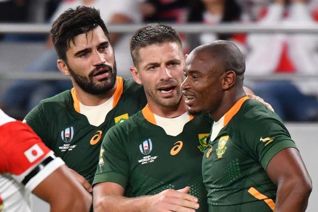 South Africa celebrate after securing victory over Japan