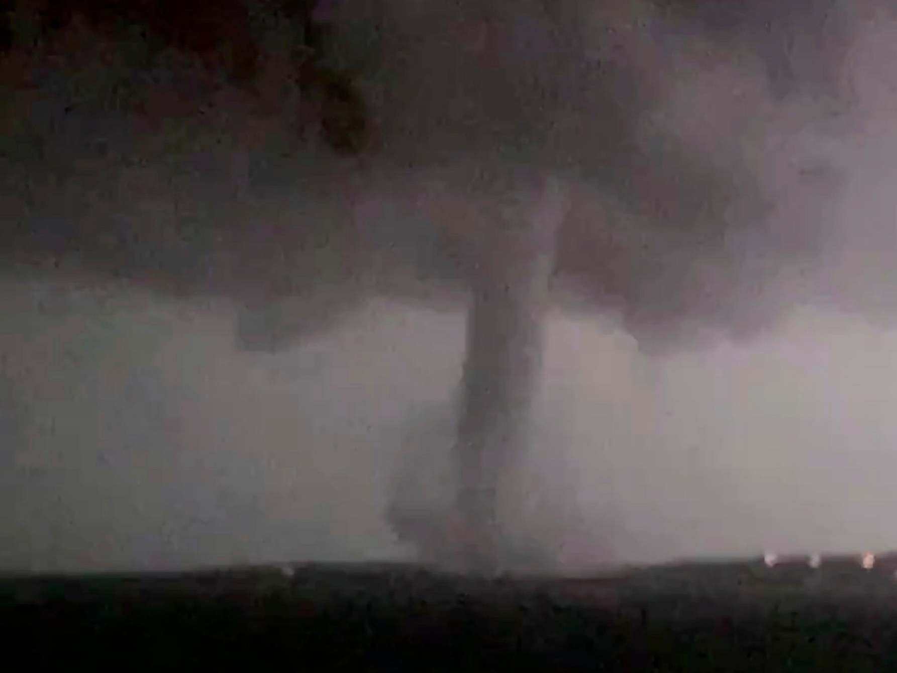 This 20 October 2019 image made from video by Twitter user @AthenaRising shows the tornado in Rockwall, Texas. The National Weather Service confirmed a tornado touched down in Dallas on Sunday night, causing structural damage and knocking out electricity to thousands.