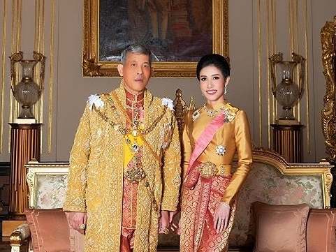 King Maha Vajiralongkorn and Sineenat Wongvajirapakdi pose at the Grand Palace in Bangkok