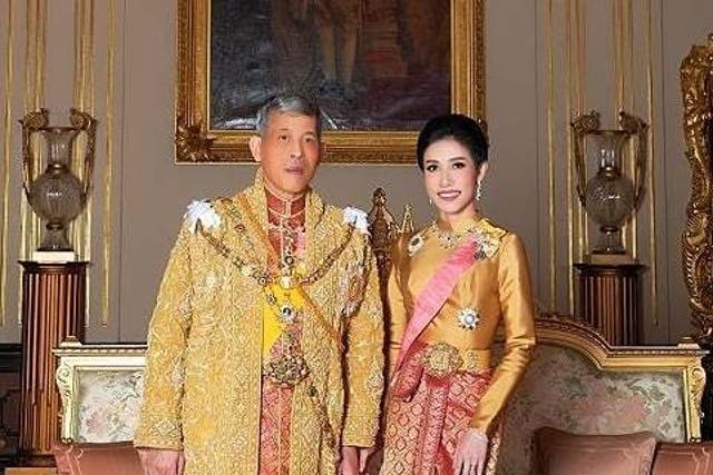 King Maha Vajiralongkorn and Sineenat Wongvajirapakdi pose at the Grand Palace in Bangkok