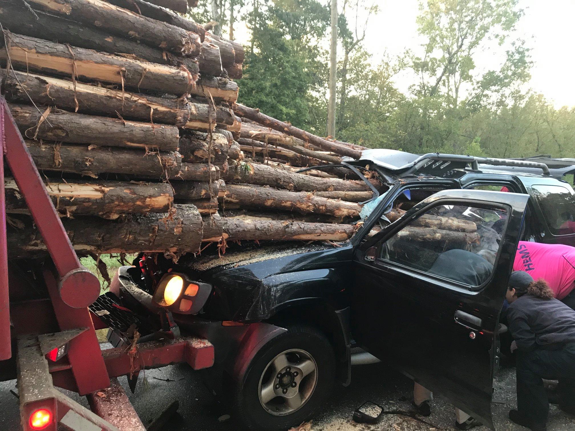 Driver's miracle escape after car impaled by logs 'when he crashed into truck while reaching for coffee'