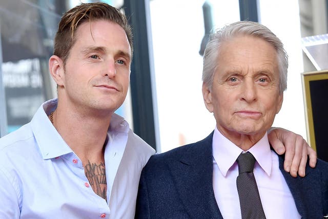 Cameron Douglas and Michael Douglas pose at the inauguration of Michael Douglas's star on the Hollywood Walk of Fame on 6 November, 2018 in Hollywood, California.