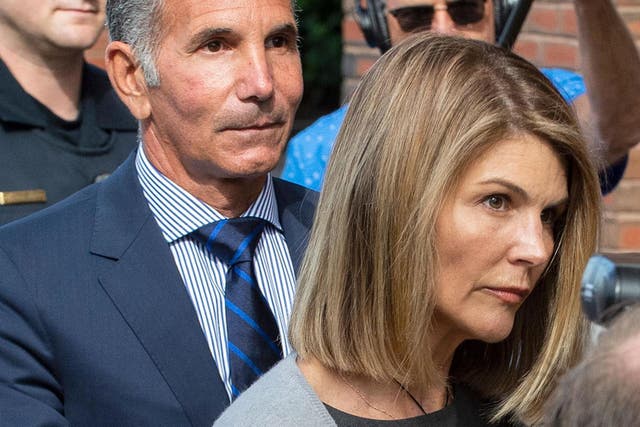 Lori Loughlin and husband Mossimo Giannulli exit the Boston federal courthouse after a pre-trial hearing on 27 August, 2019.