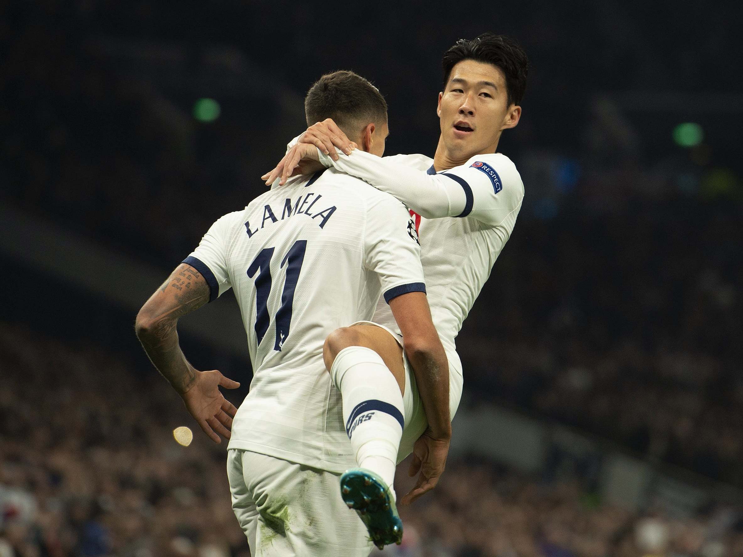 Erik Lamela and Son Heung-min celebrate