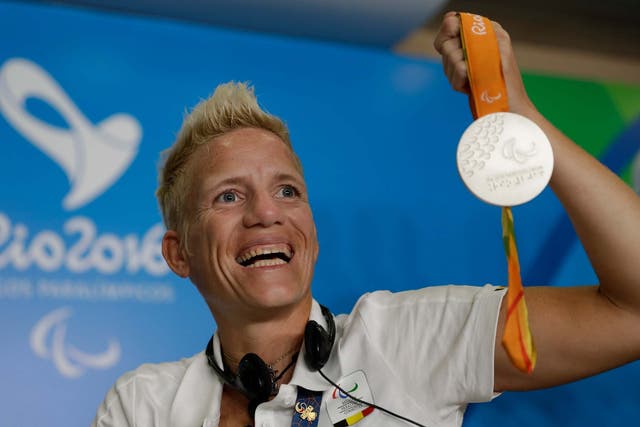 Belgium's Marieke Vervoort holds up her silver medal from the 2016 Rio Paralympic games